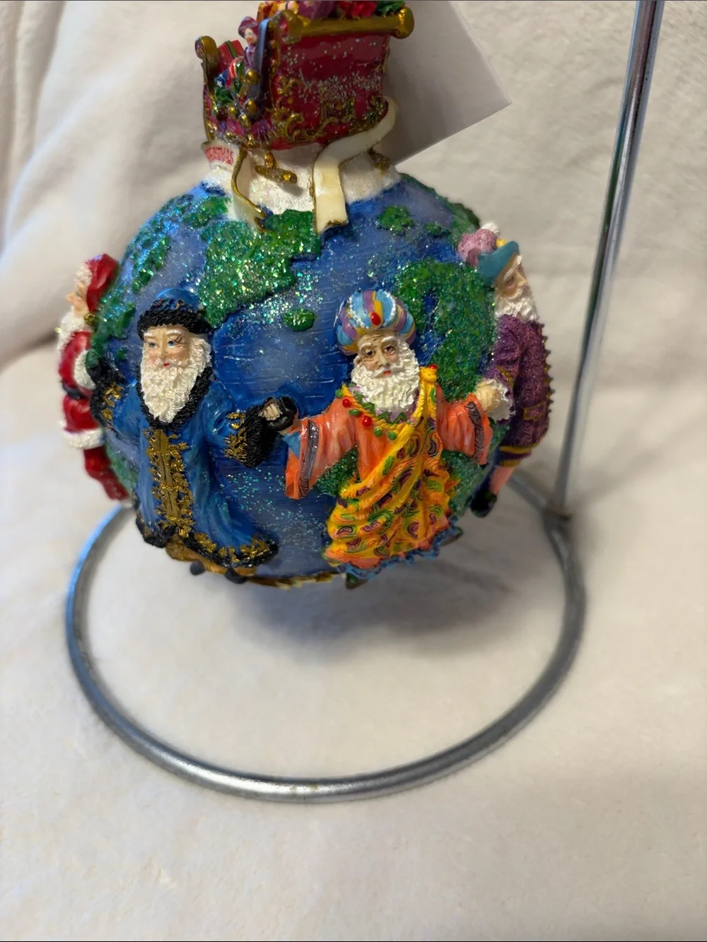 Christopher Radko Santa’s around the world with tag